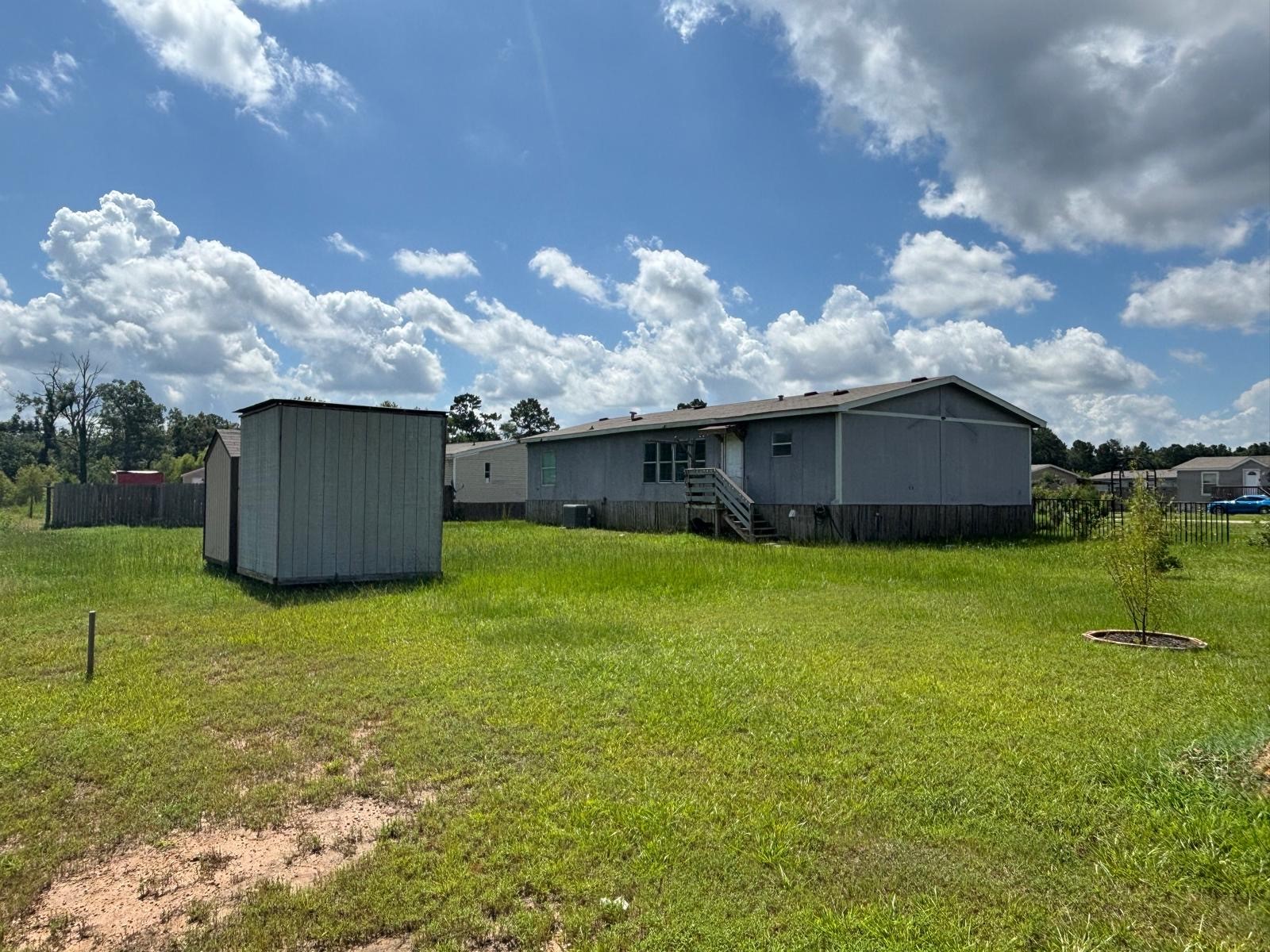 8021 Matthew Steven Drive Conroe, TX 77306 - Photo 23 of 24 a house view with a garden space
