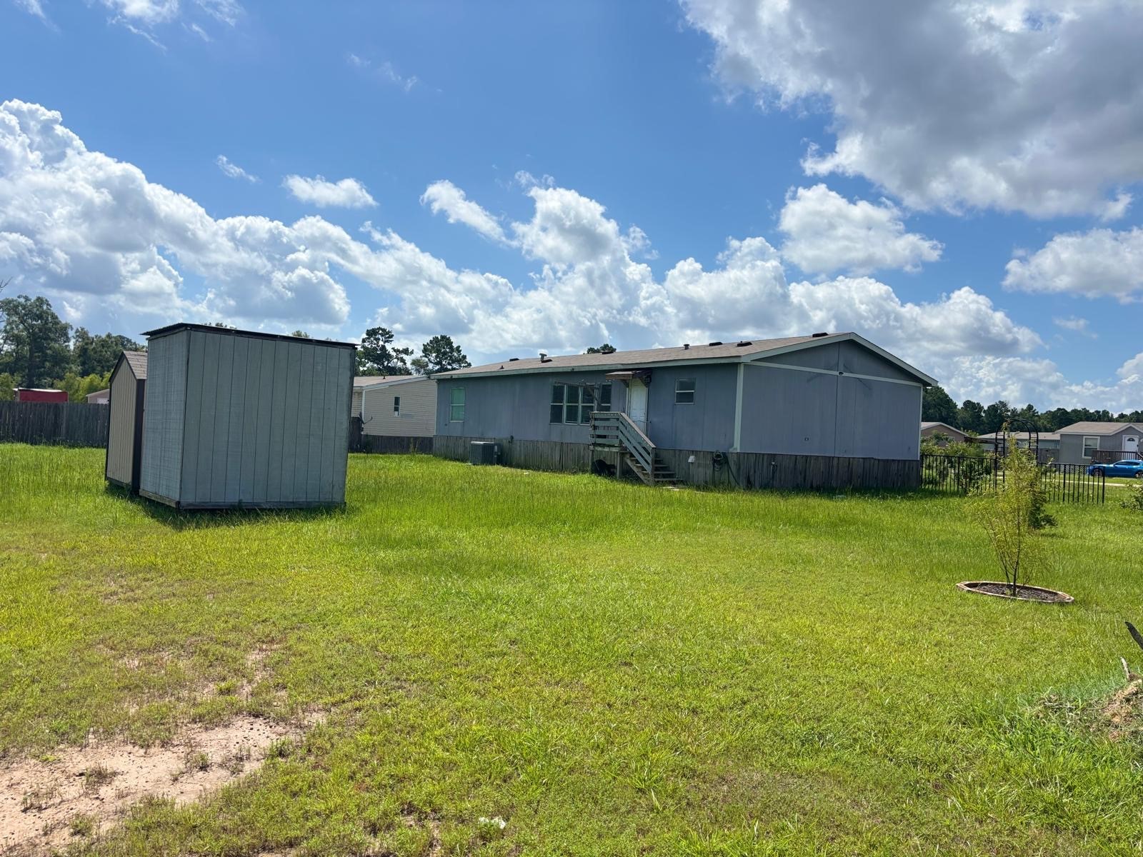 8021 Matthew Steven Drive Conroe, TX 77306 - Photo 24 of 24 a house view with a garden space
