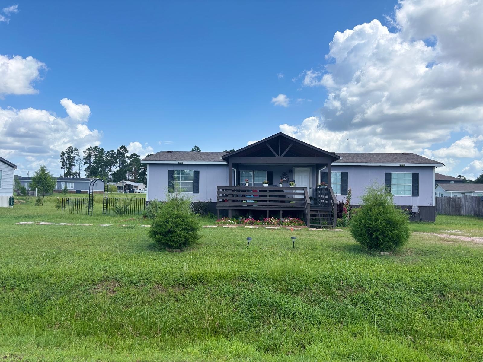 8021 Matthew Steven Drive Conroe, TX 77306 - Photo 3 of 24 a view of a house with a yard
