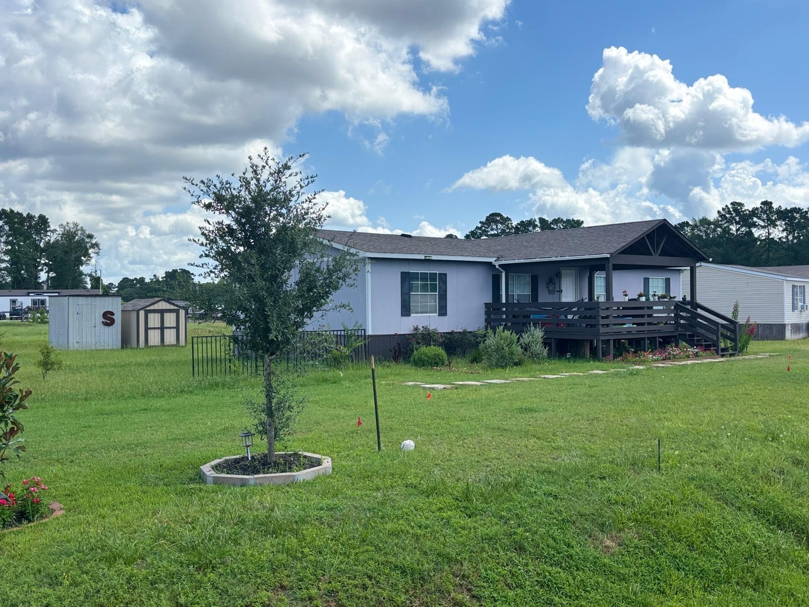 8021 Matthew Steven Drive Conroe, TX 77306 - Photo 5 of 24 a front view of a house with garden