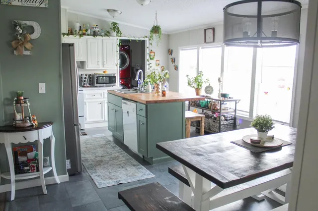 a kitchen with a table and chairs in it