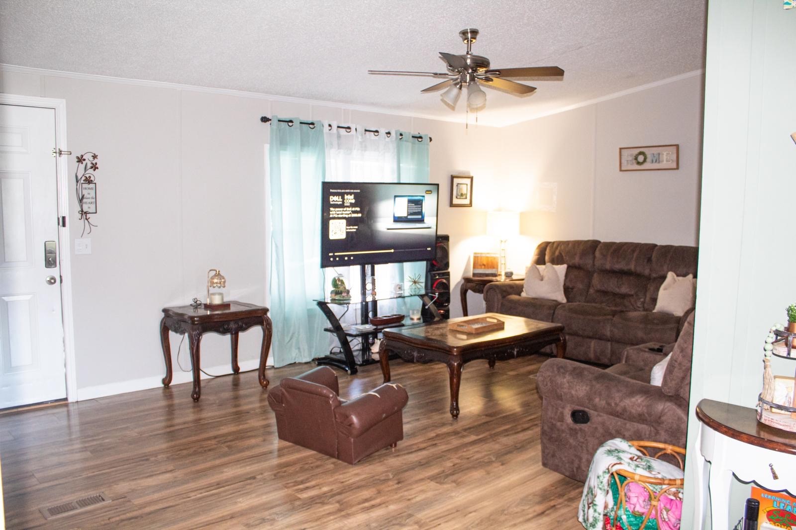 8021 Matthew Steven Drive Conroe, TX 77306 - Photo 10 of 24 a living room with furniture and a wooden floor
