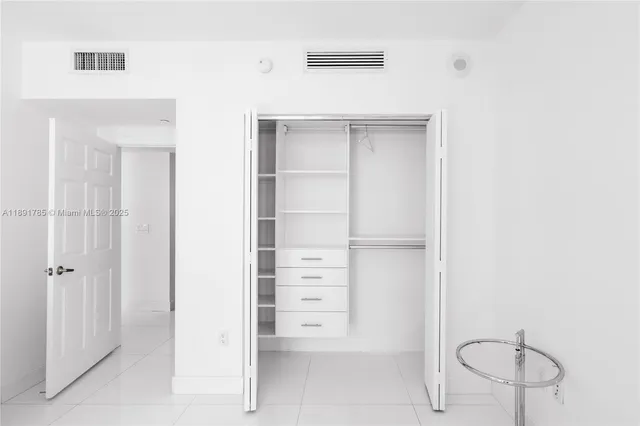 a bathroom with a shower and a toilet