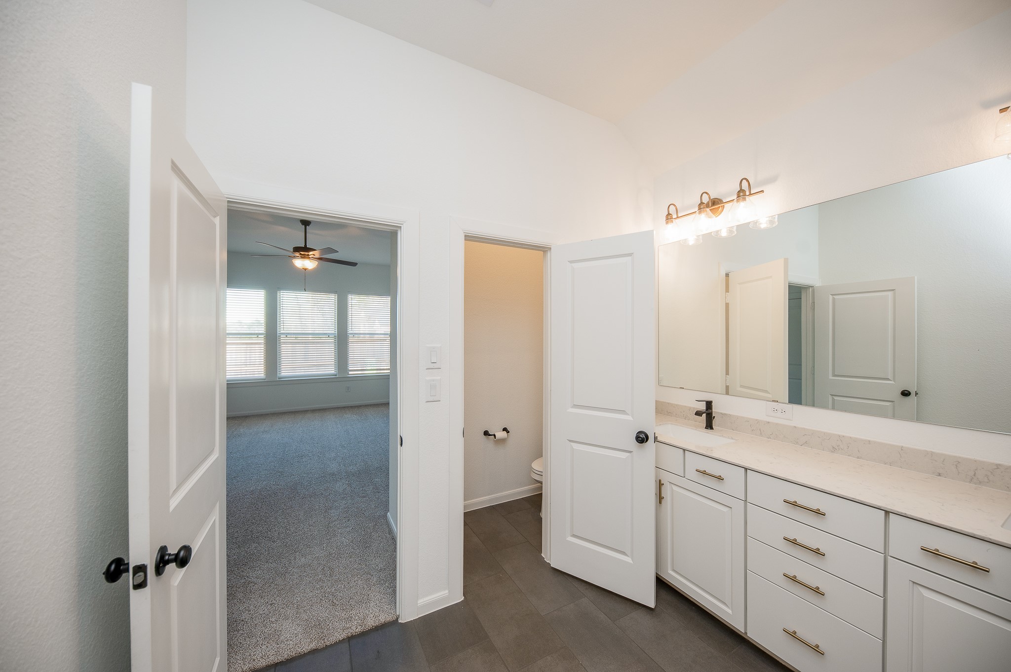 42514 Summer Crst Road Magnolia, TX 77354 - Photo 23 of 50 En suite restroom comes with a double sink and in closed toilet room