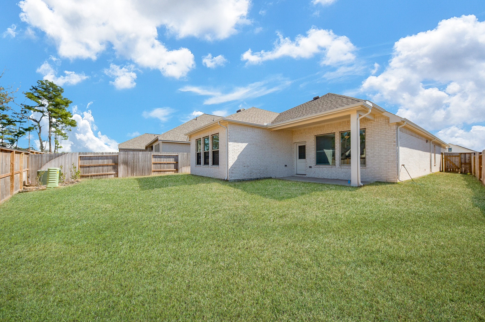 42514 Summer Crst Road Magnolia, TX 77354 - Photo 48 of 50 a view of a house with backyard porch and garden