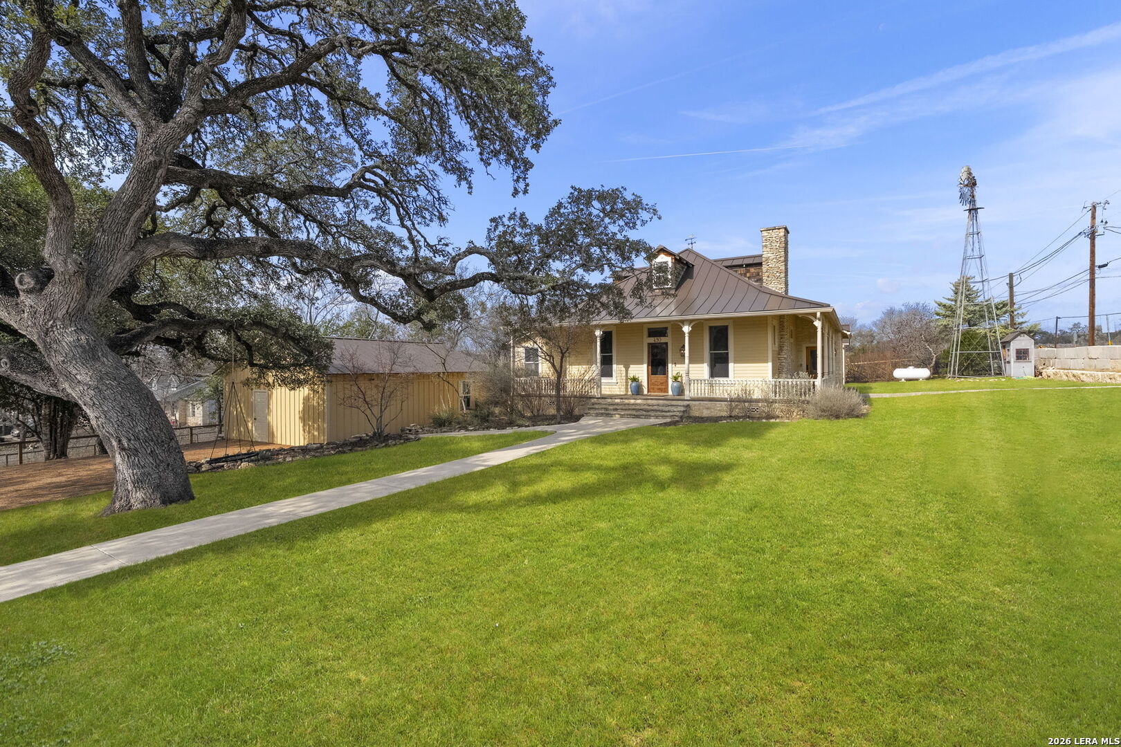 107 High Street Comfort, TX 78013 - Photo 1 of 47 a front view of a house with garden