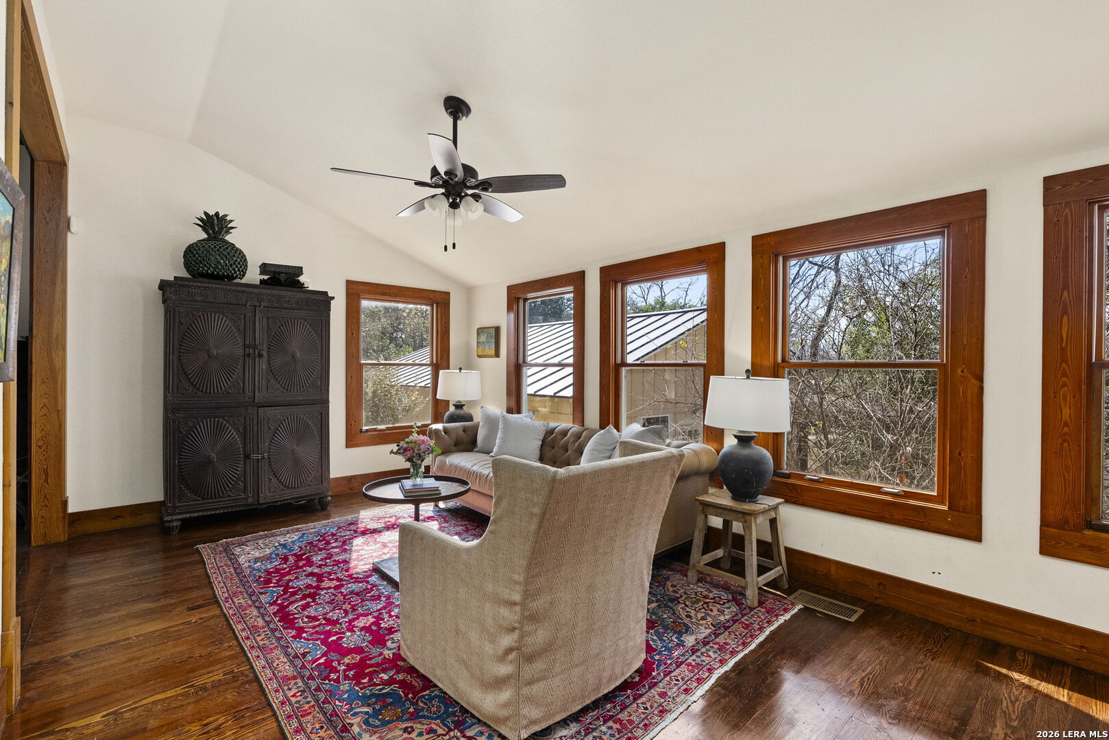 107 High Street Comfort, TX 78013 - Photo 14 of 47 a living room with furniture a window and a chandelier