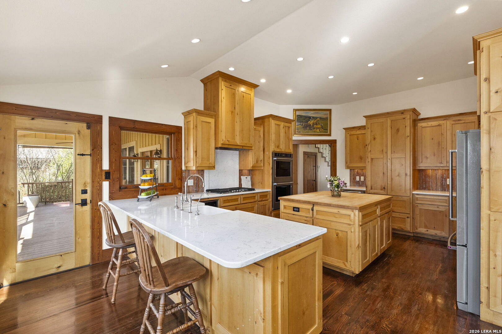 107 High Street Comfort, TX 78013 - Photo 16 of 47 a kitchen with stainless steel appliances a stove a sink a refrigerator and island