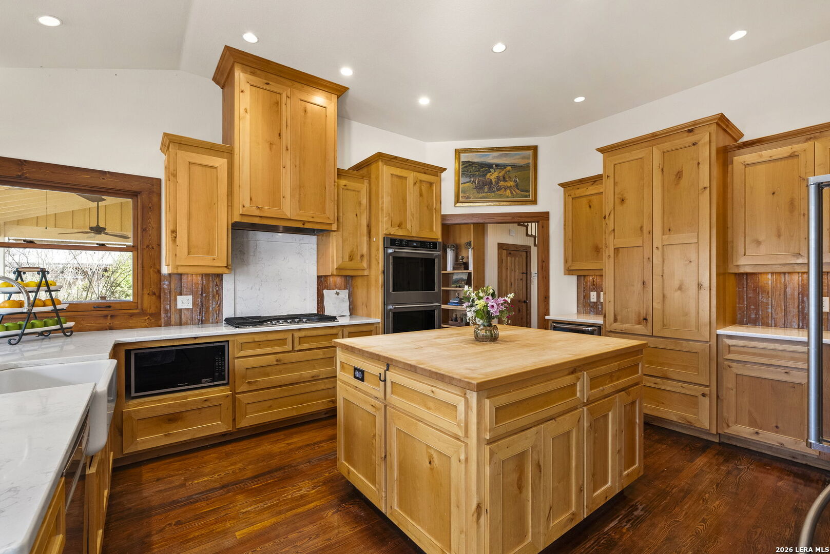 107 High Street Comfort, TX 78013 - Photo 18 of 47 a kitchen with stainless steel appliances granite countertop a stove and a sink