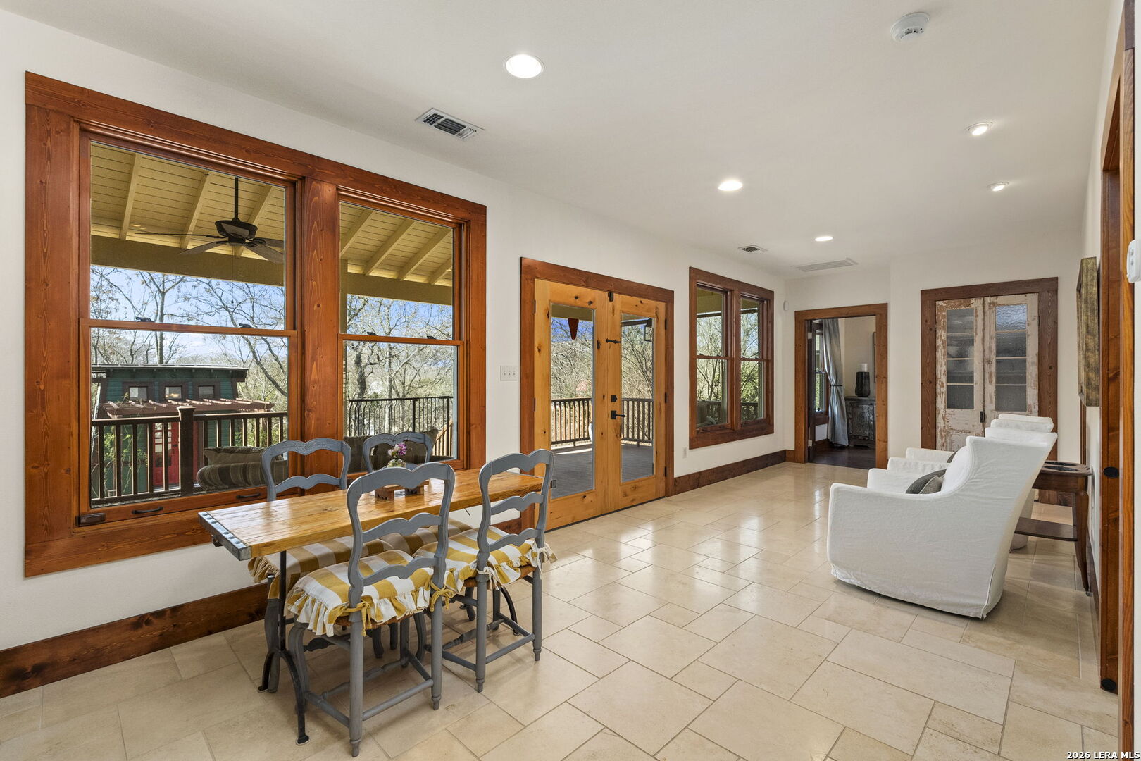 107 High Street Comfort, TX 78013 - Photo 19 of 47 a view of a dining room with furniture large windows and wooden floor