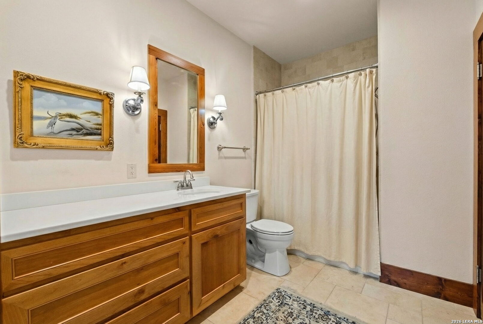 107 High Street Comfort, TX 78013 - Photo 26 of 47 a bathroom with a sink a toilet a mirror and shower