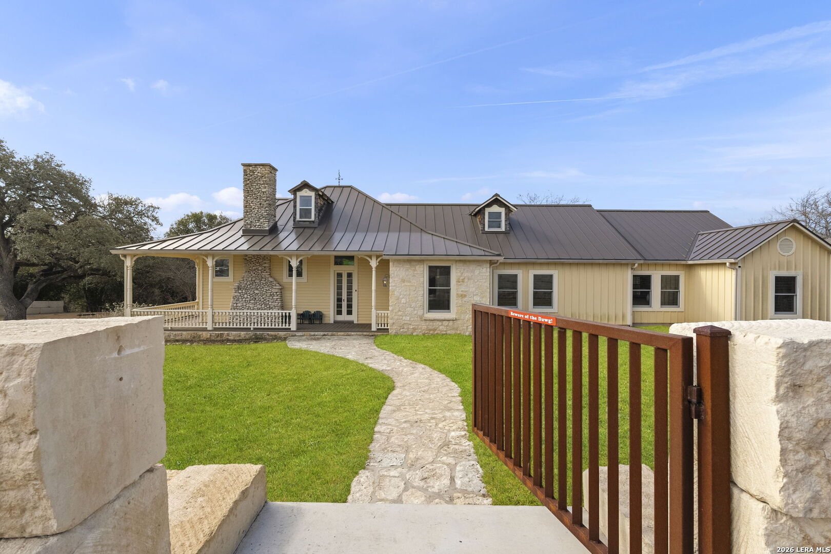 107 High Street Comfort, TX 78013 - Photo 3 of 47 a front view of a house with garden