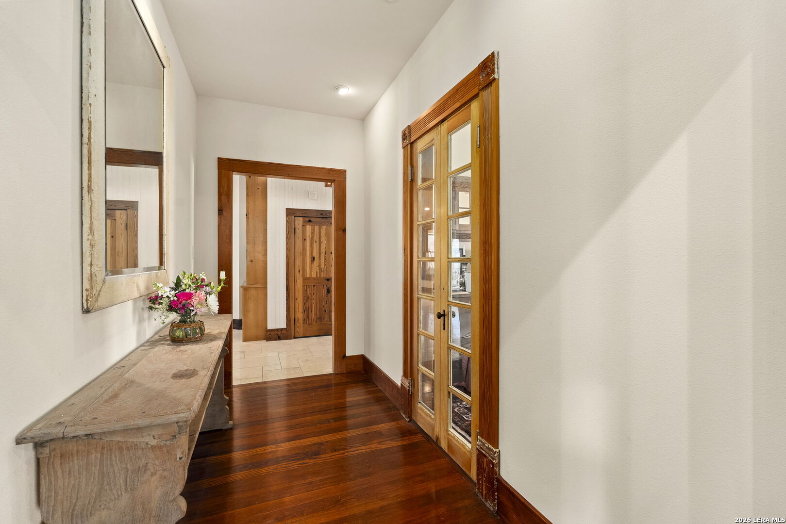 107 High Street Comfort, TX 78013 - Photo 33 of 47 a hallway with wooden floor and windows
