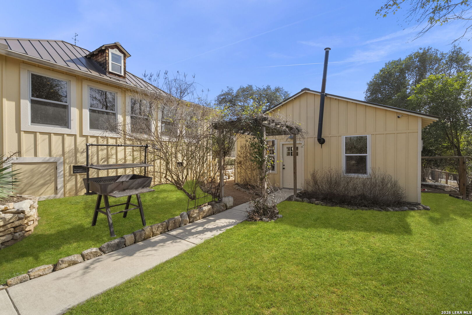 107 High Street Comfort, TX 78013 - Photo 38 of 47 a front view of a house with garden