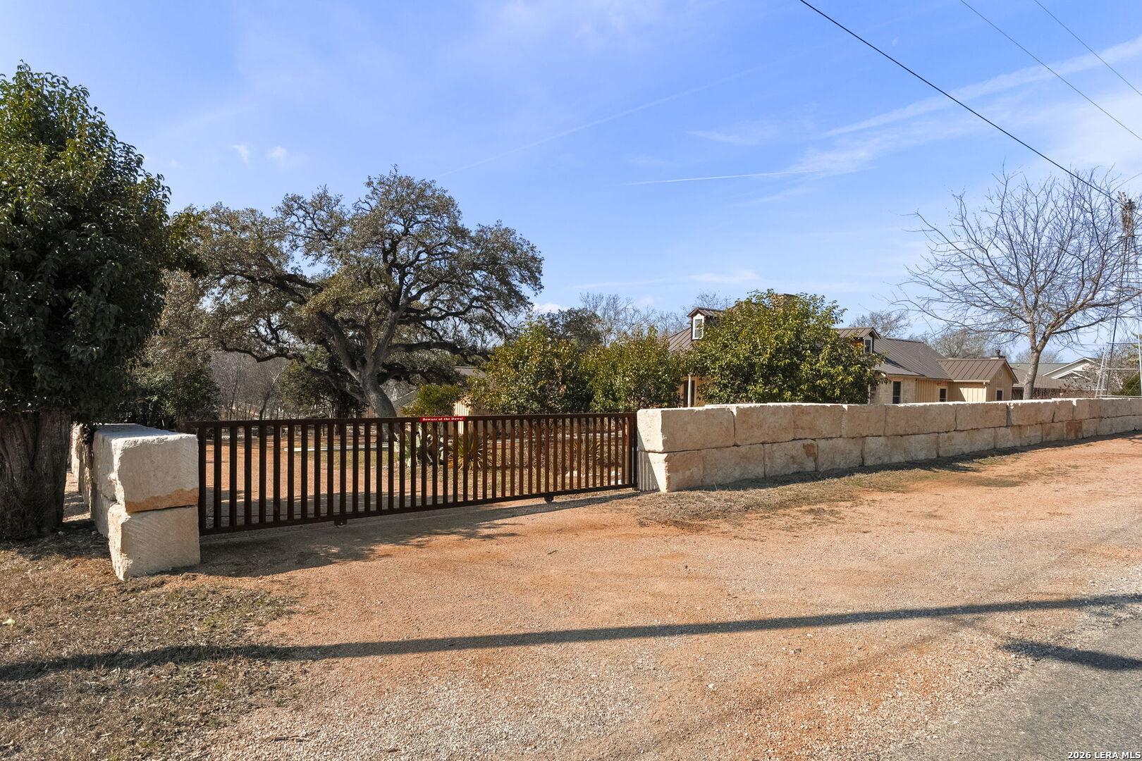107 High Street Comfort, TX 78013 - Photo 46 of 47 a view of backyard with wooden fence and trees