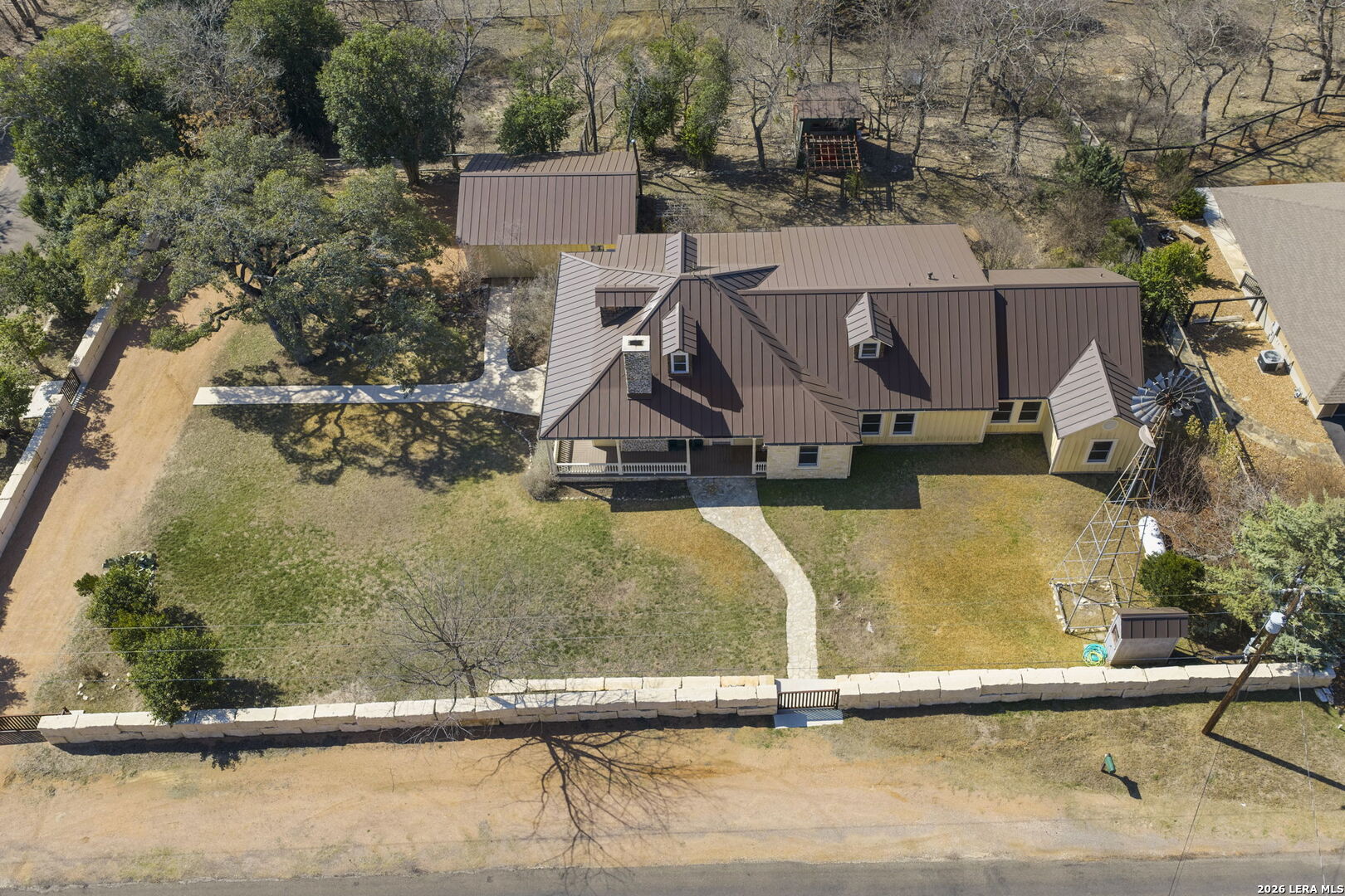 107 High Street Comfort, TX 78013 - Photo 47 of 47 an aerial view of a house with swimming pool and lake view