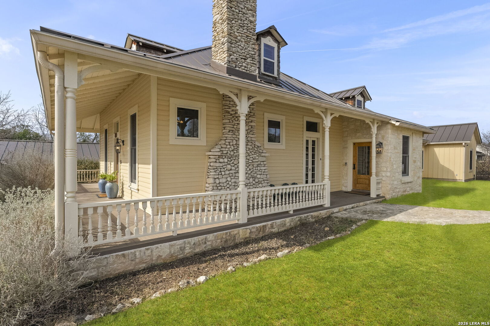 107 High Street Comfort, TX 78013 - Photo 5 of 47 a view of a house with a yard and wooden fence