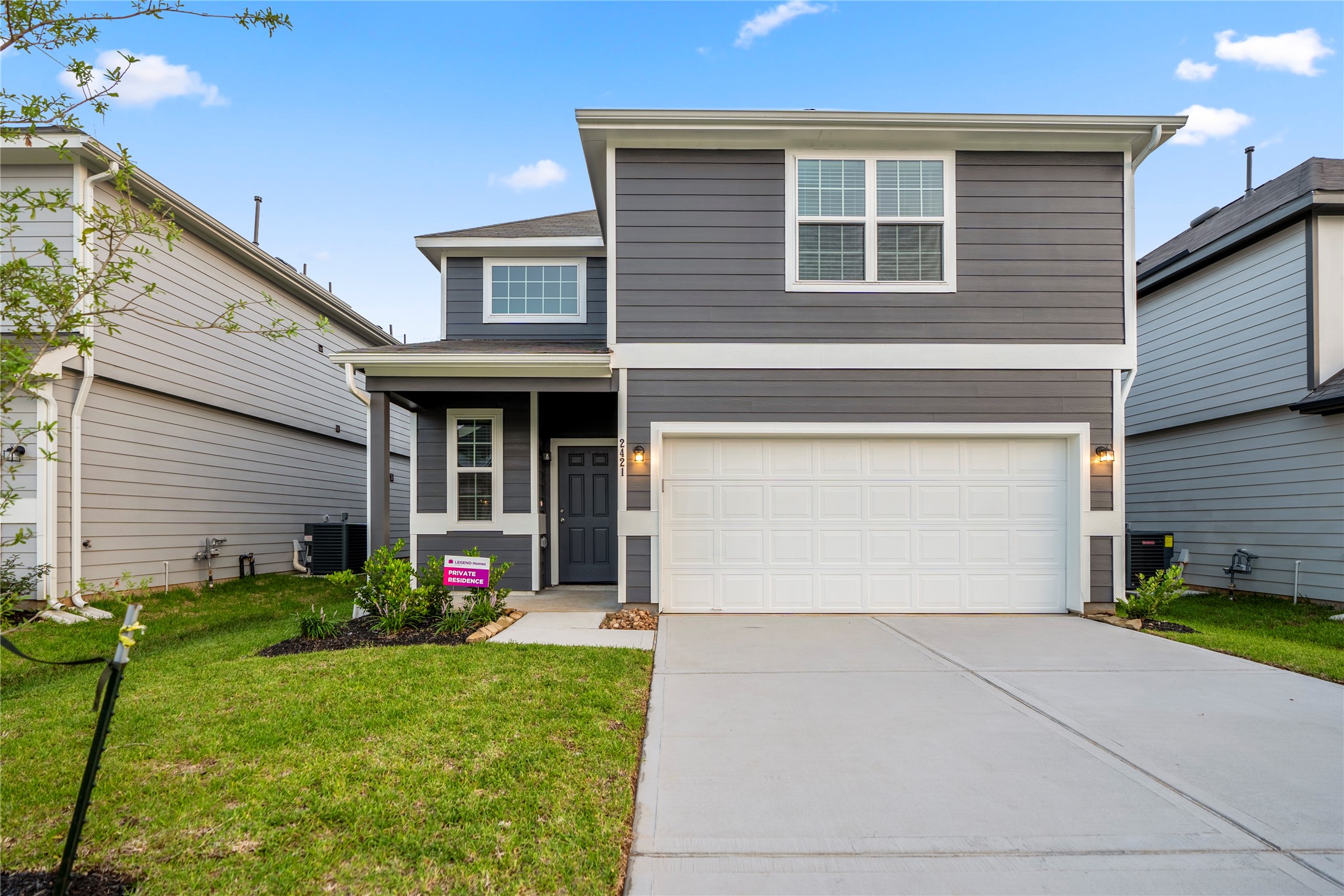 2421 Shellcracker Drive Conroe, TX 77384 - Photo 1 of 43 a front view of a house with a yard and garage