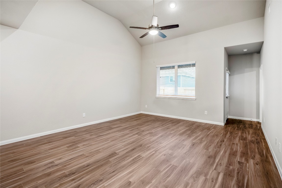 2421 Shellcracker Drive Conroe, TX 77384 - Photo 18 of 43 wooden floor in an empty room with a window