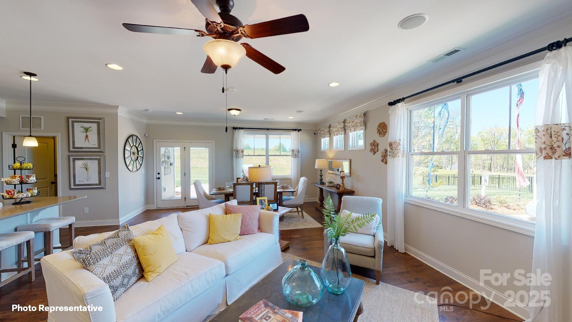 112 Noah Lane Troutman, NC 28166 - Photo 12 of 27 a living room with furniture and a large window