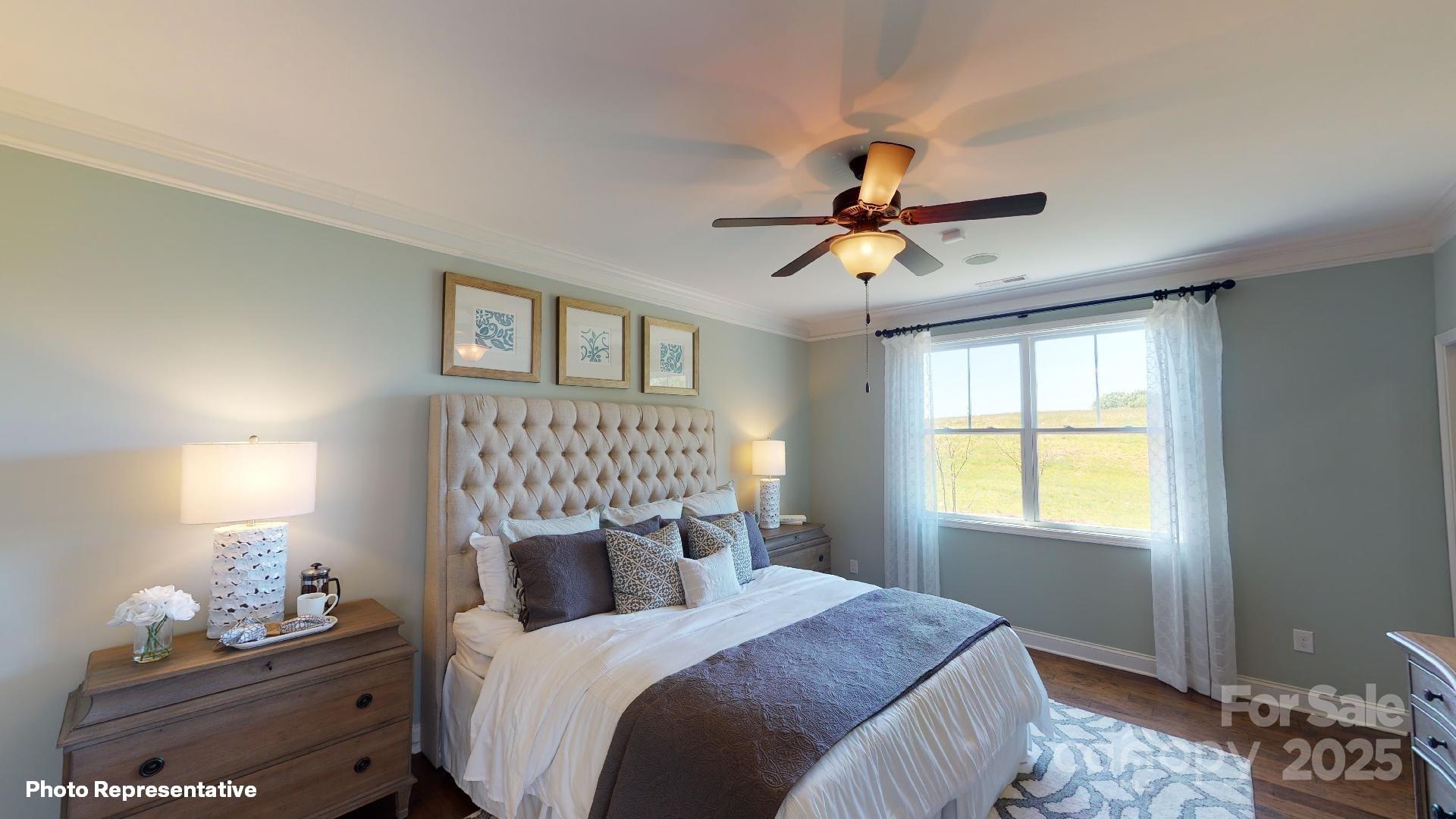 112 Noah Lane Troutman, NC 28166 - Photo 6 of 27 a bedroom with a bed and a window