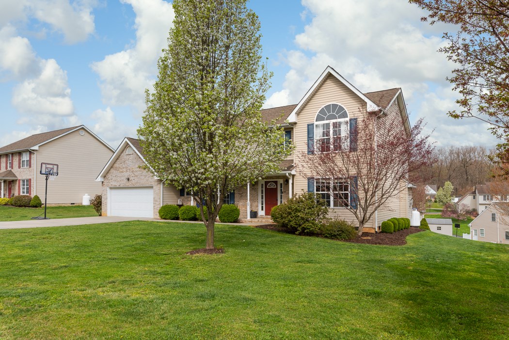 69 Sir Robin Road Waynesboro, VA 22980 - Photo 4 of 32 a front view of a house with a yard and trees