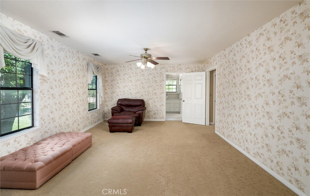 34150 Stowe Road Winchester, CA 92545 - Photo 29 of 80 a living room with furniture and a chandelier