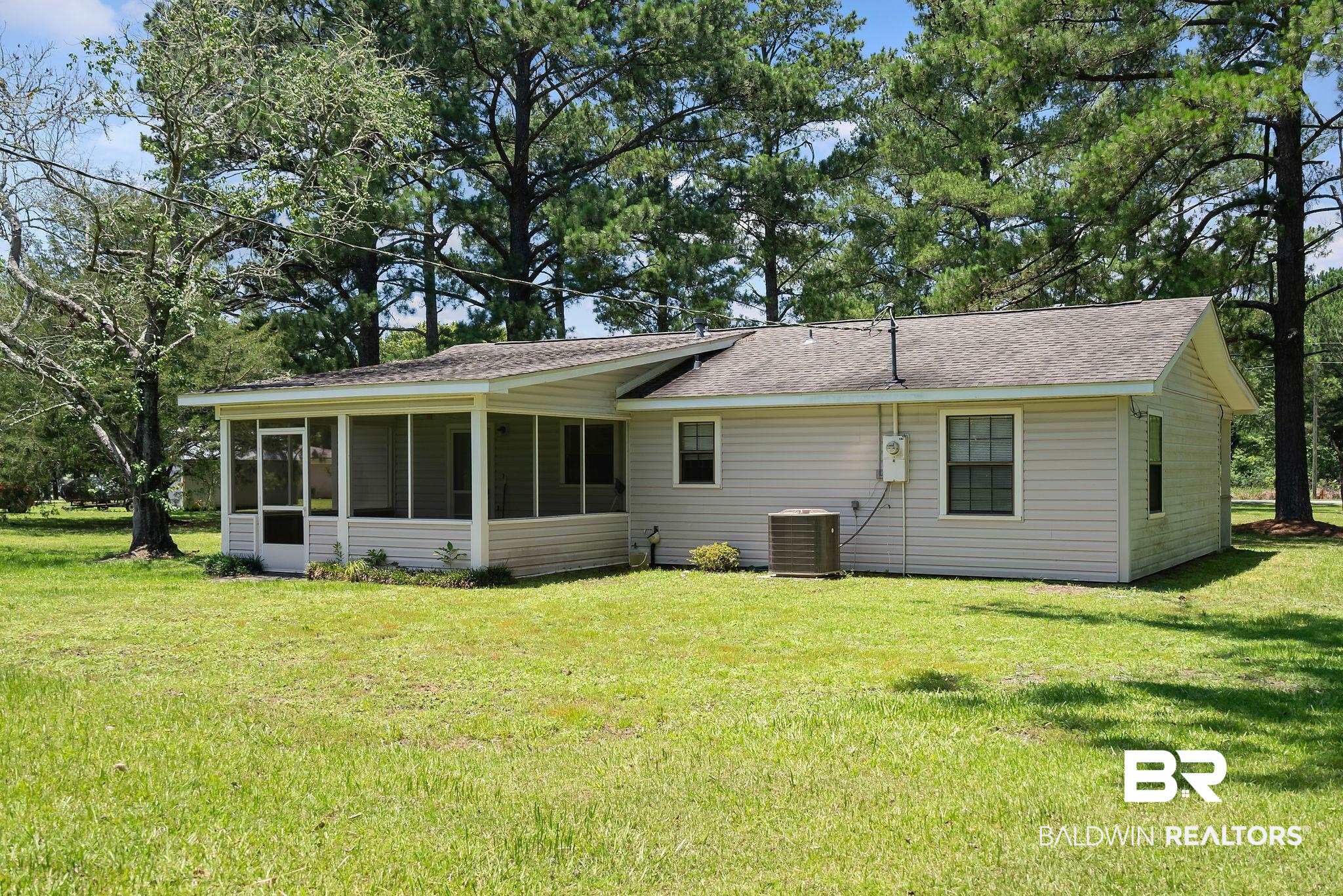 20540 Lacey Road Silverhill, AL 36576 - Photo 24 of 40 Single-story property featuring light-colored siding and a screened porch
