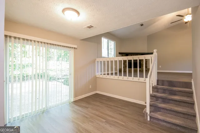 a view of entryway with wooden floor