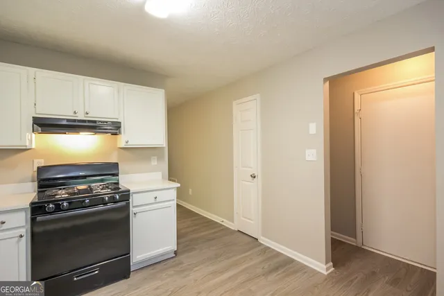 a kitchen with cabinets and appliances