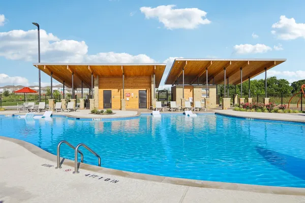 a view of swimming pool with a patio