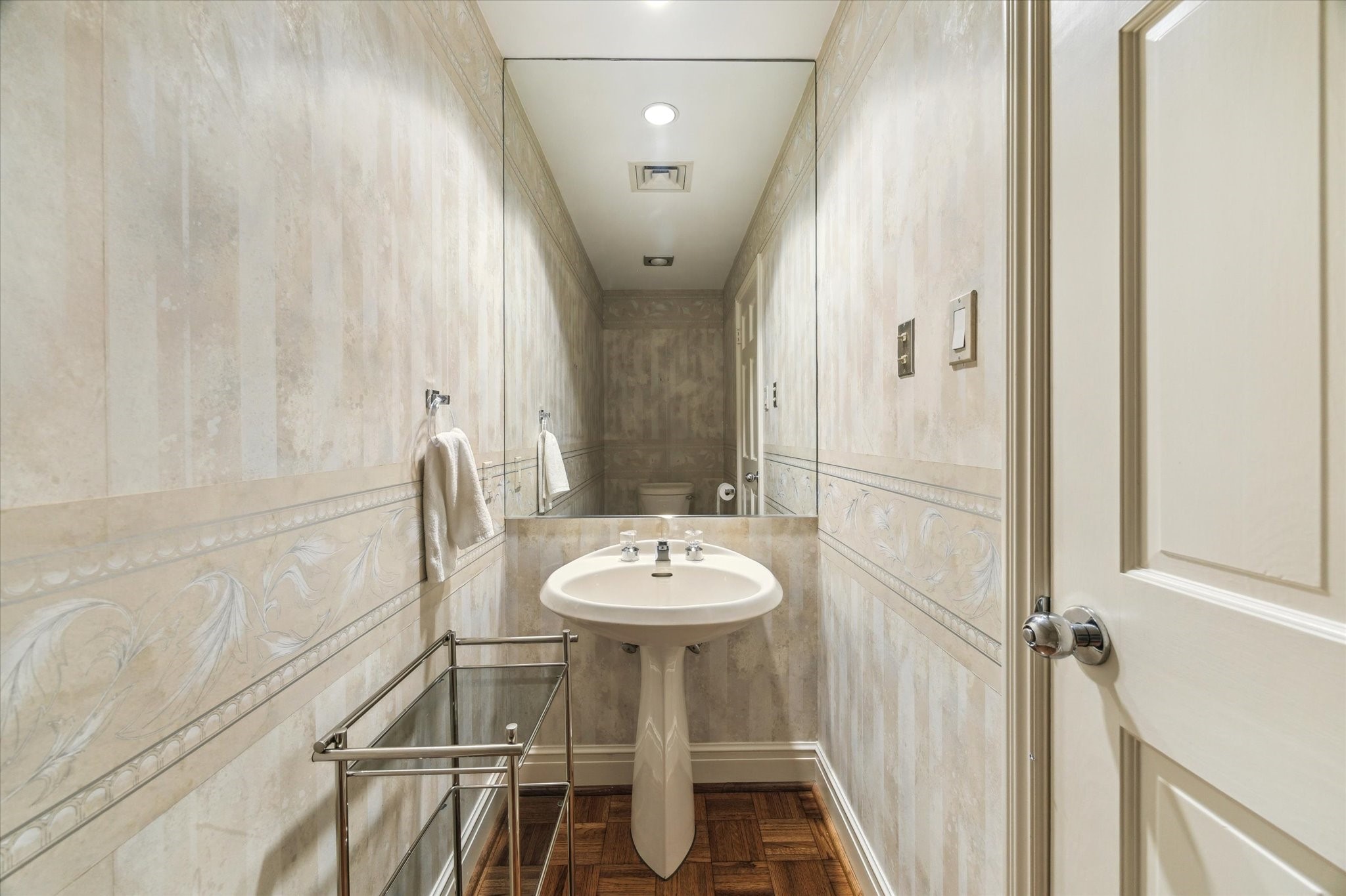 1111 Hermann Drive, Unit 7F Houston, TX 77004 - Photo 12 of 42 a bathroom with a sink and a mirror