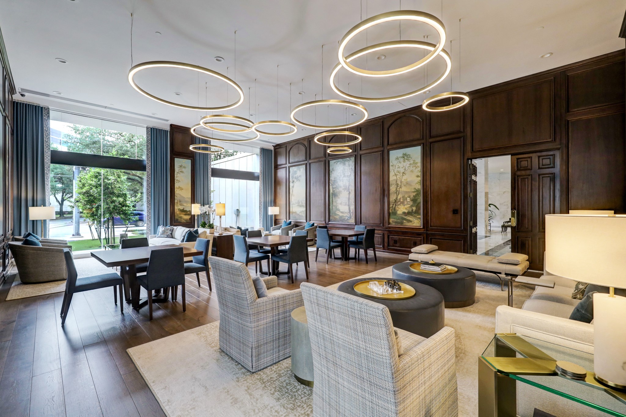 1111 Hermann Drive, Unit 7F Houston, TX 77004 - Photo 30 of 42 a living room with couches a dining table and chairs with wooden floor
