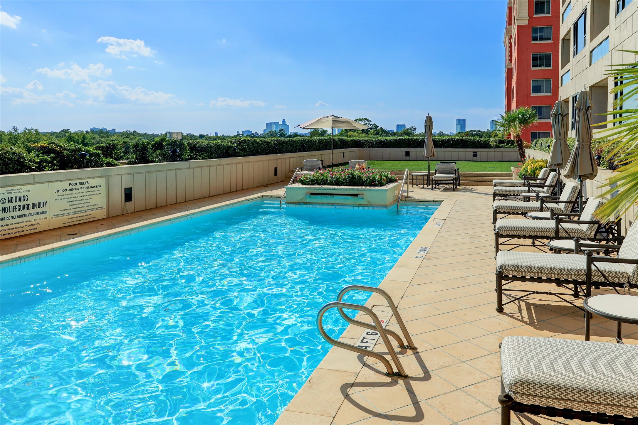 1111 Hermann Drive, Unit 7F Houston, TX 77004 - Photo 35 of 42 a view of swimming pool with seating area and lake view
