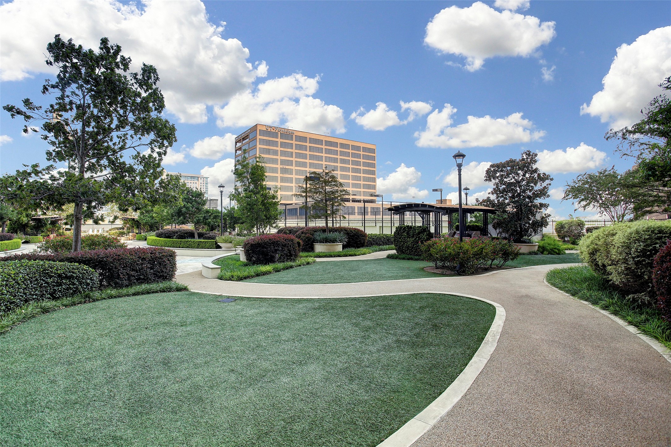 1111 Hermann Drive, Unit 7F Houston, TX 77004 - Photo 39 of 42 a view of a fountain in front of a house with a big yard