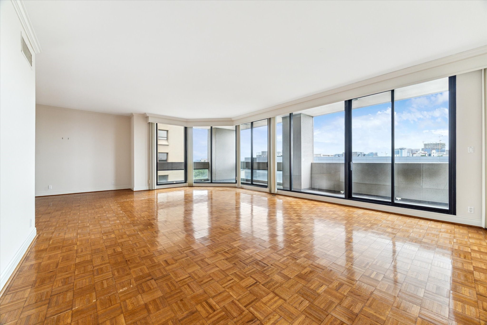 1111 Hermann Drive, Unit 7F Houston, TX 77004 - Photo 7 of 42 a view of an empty room with a window