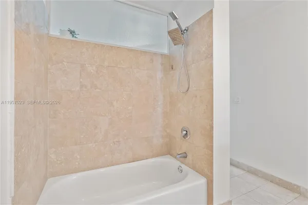 a bathroom with a white bath tub