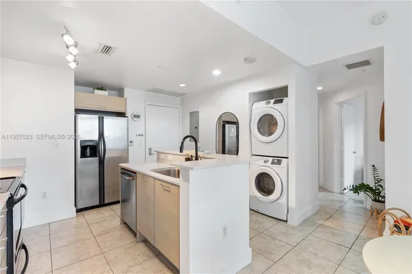 a view of kitchen and washer and dryer