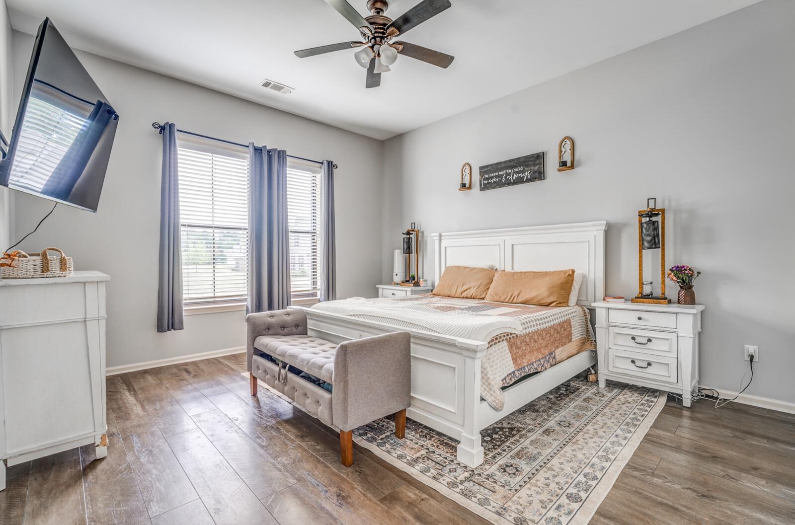 4671 Hampton Ridge Lane Bartlett, TN 38002 - Photo 23 of 40 Spacious bedroom featuring wood-finish flooring and a ceiling fan