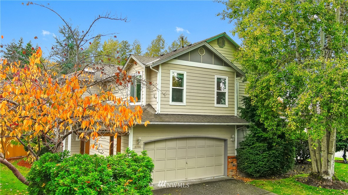18704 20th Avenue Southeast Bothell, WA 98012 - Photo 1 of 27 a front view of a house with a yard