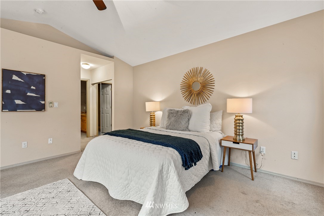 18704 20th Avenue Southeast Bothell, WA 98012 - Photo 11 of 27 a bedroom with a bed and a lamp on table