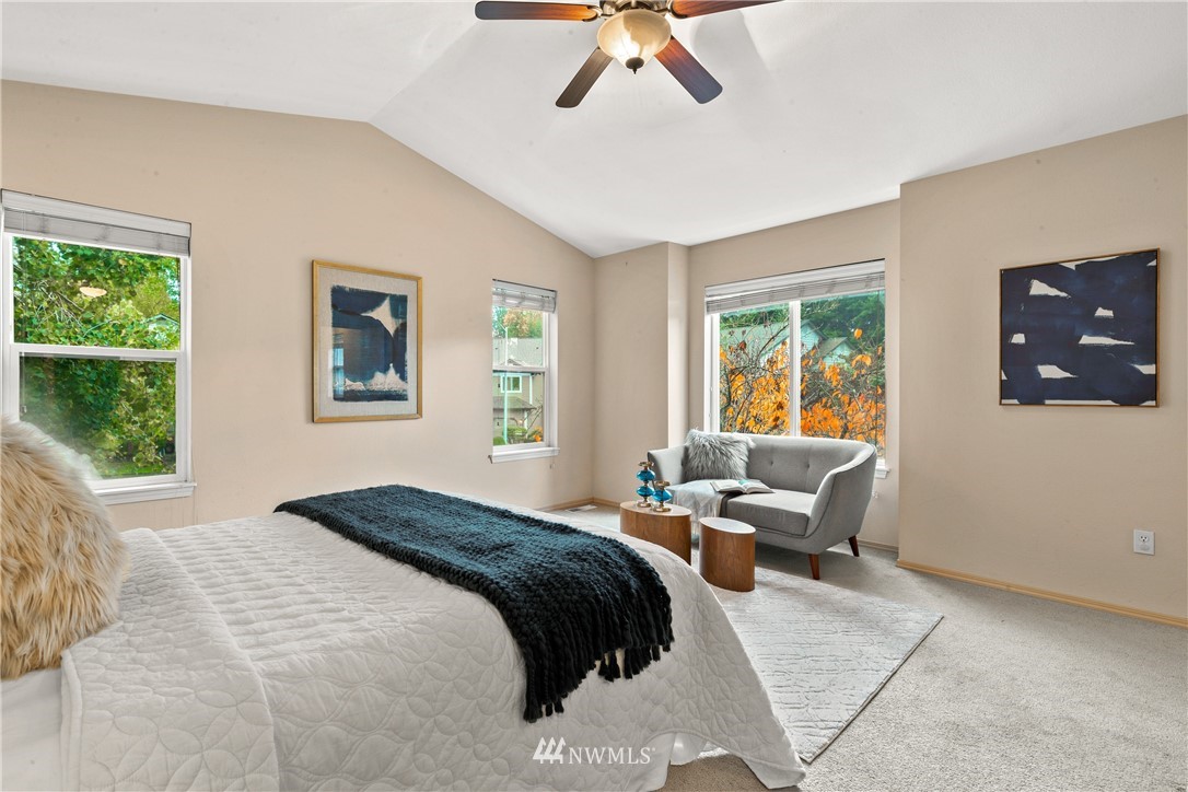 18704 20th Avenue Southeast Bothell, WA 98012 - Photo 12 of 27 a bedroom with a bed couch and window