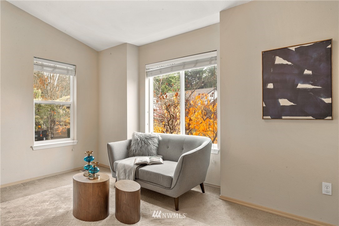18704 20th Avenue Southeast Bothell, WA 98012 - Photo 13 of 27 a living room with furniture and a window