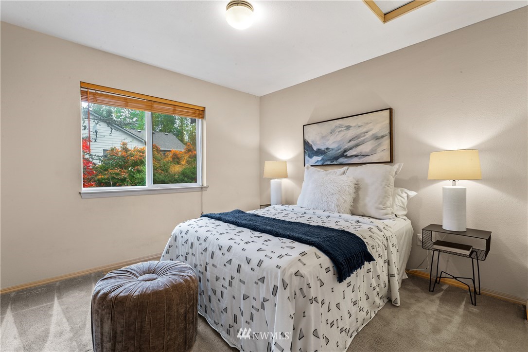 18704 20th Avenue Southeast Bothell, WA 98012 - Photo 16 of 27 a bedroom with a bed and a painting on the wall