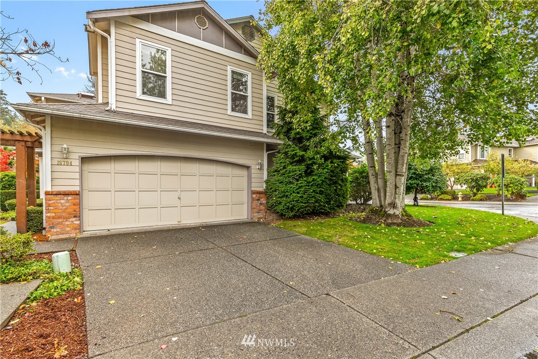 18704 20th Avenue Southeast Bothell, WA 98012 - Photo 23 of 27 a front view of a house with garden