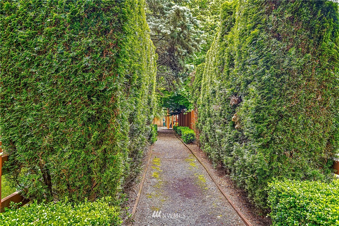 18704 20th Avenue Southeast Bothell, WA 98012 - Photo 24 of 27 a view of a pathway both side of white house