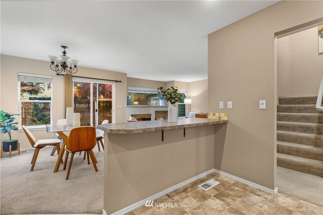 18704 20th Avenue Southeast Bothell, WA 98012 - Photo 7 of 27 a living room with a couch and chandelier