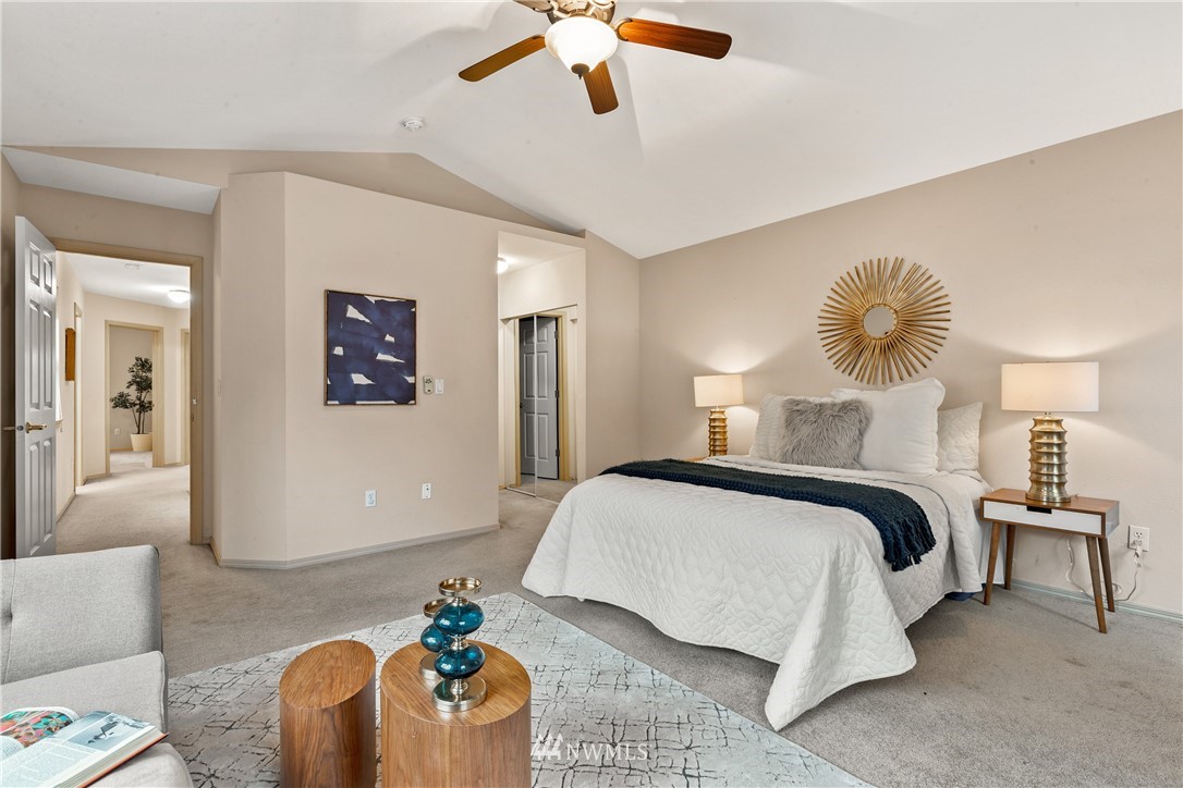 18704 20th Avenue Southeast Bothell, WA 98012 - Photo 10 of 27 a bedroom with a bed and a chandelier