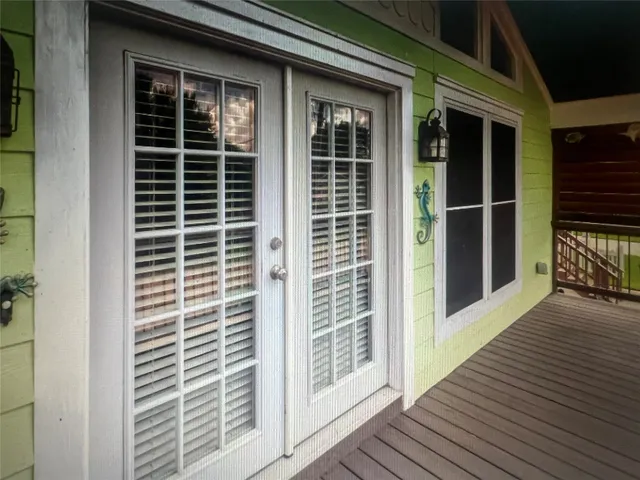 a view of balcony and wooden floor