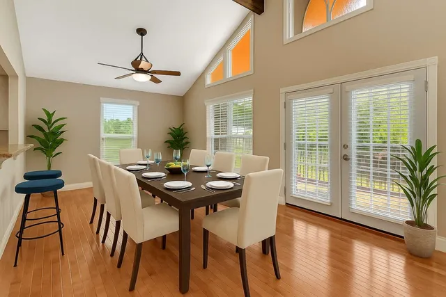 a view of a dining room with furniture window and wooden floor